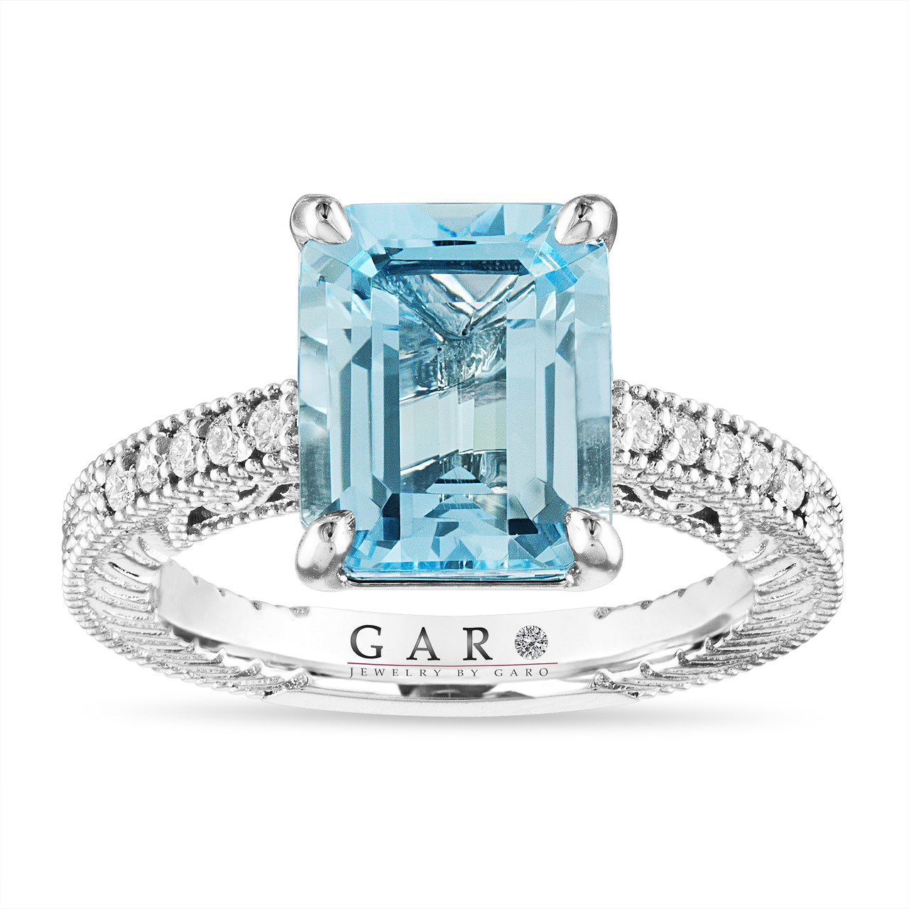 18ct White Gold Emerald Cut Aquamarine Ring with Diamond Shoulders